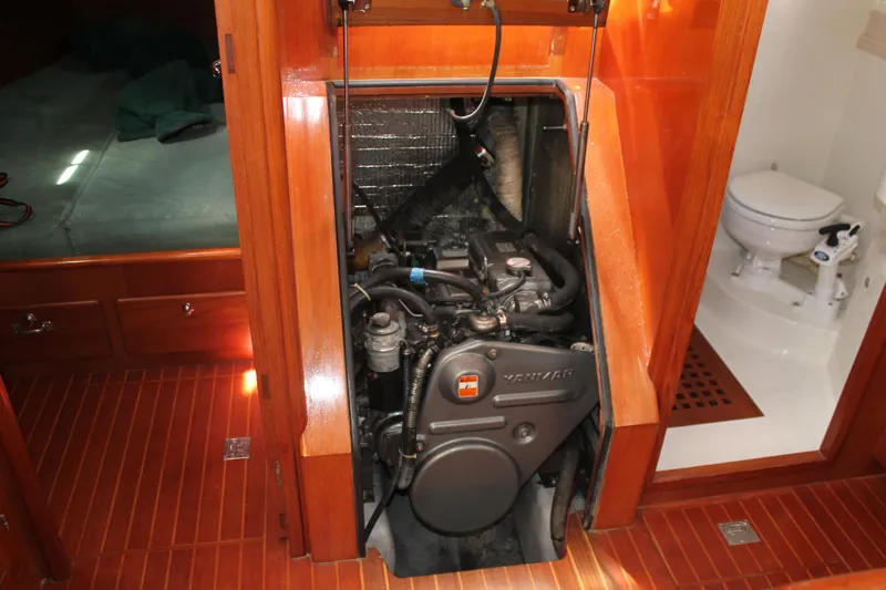 Callisto Yacht Photos Pics Engine compartment of a 2009 Outbound 46 yacht, featuring a well-maintained marine engine.