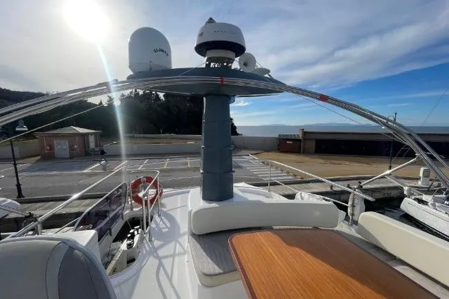 Boa Sorte Yacht Photos Pics 2017 Azimut Magellano 53 yacht deck with radar, seating, and ocean view.