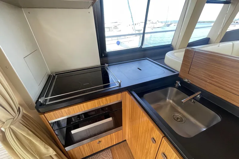Boa Sorte Yacht Photos Pics Modern kitchen in 2017 Azimut Magellano 53 yacht with stove and sink.