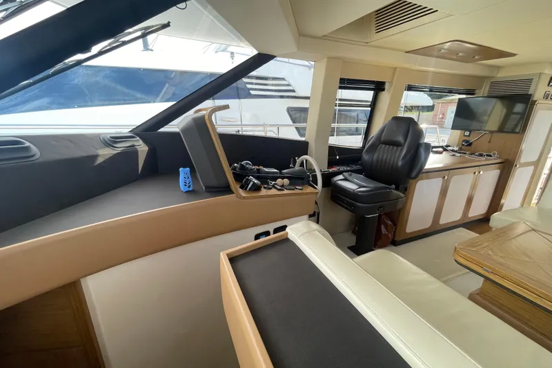 Boa Sorte Yacht Photos Pics Interior of 2017 Azimut Magellano 53 yacht, featuring helm station and seating area.