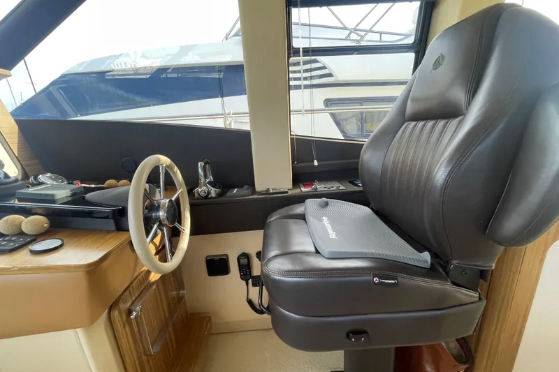 Boa Sorte Yacht Photos Pics Pilot seat and steering wheel of 2017 Azimut Magellano 53 yacht interior.