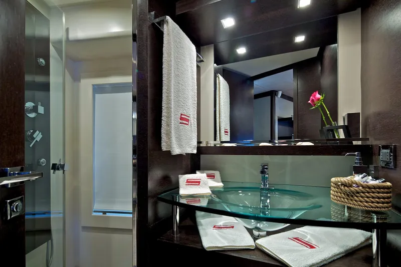  Yacht Photos Pics Luxurious bathroom interior of 2008 Azimut 86S yacht with modern glass sink and elegant decor.