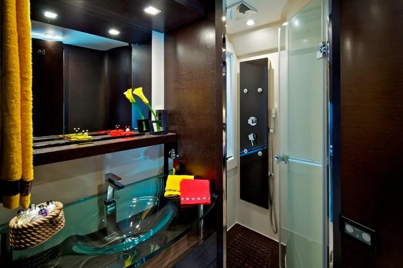  Yacht Photos Pics Luxurious bathroom interior of 2008 Azimut 86S yacht with modern fixtures and glass sink.