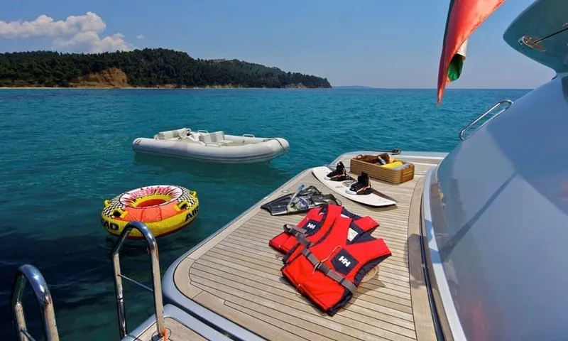  Yacht Photos Pics Luxury yacht Azimut 86S deck with life vests, inflatable boat, and scenic ocean view.