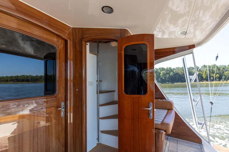 Badonkadonk Yacht Photos Pics 2005 76 Whiticar Enclosed Bridge Badonkadonk Deck Stairs to Bridge