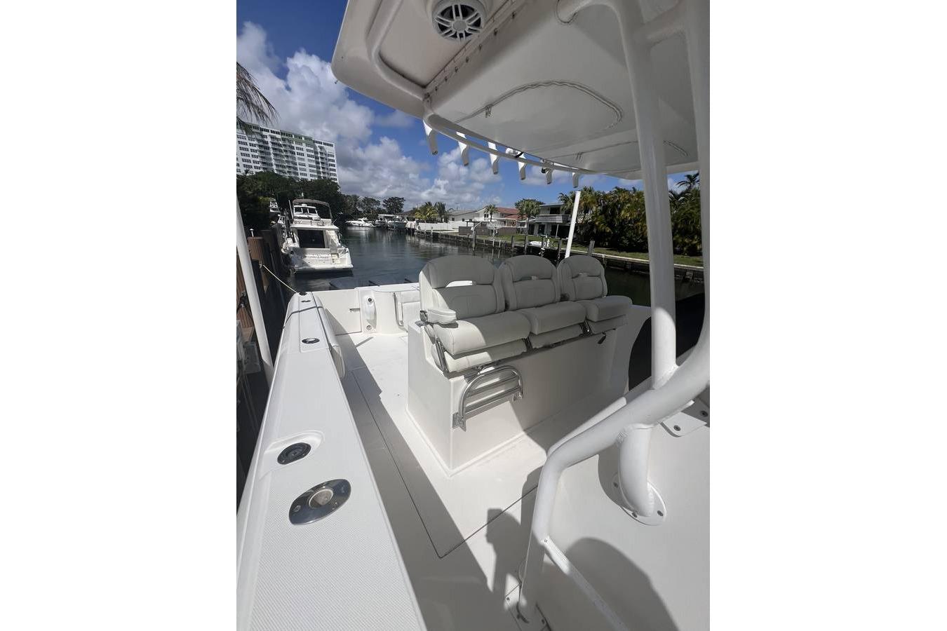 2014 Stamas 390 Tarpon boat docked, featuring spacious seating and sleek design.