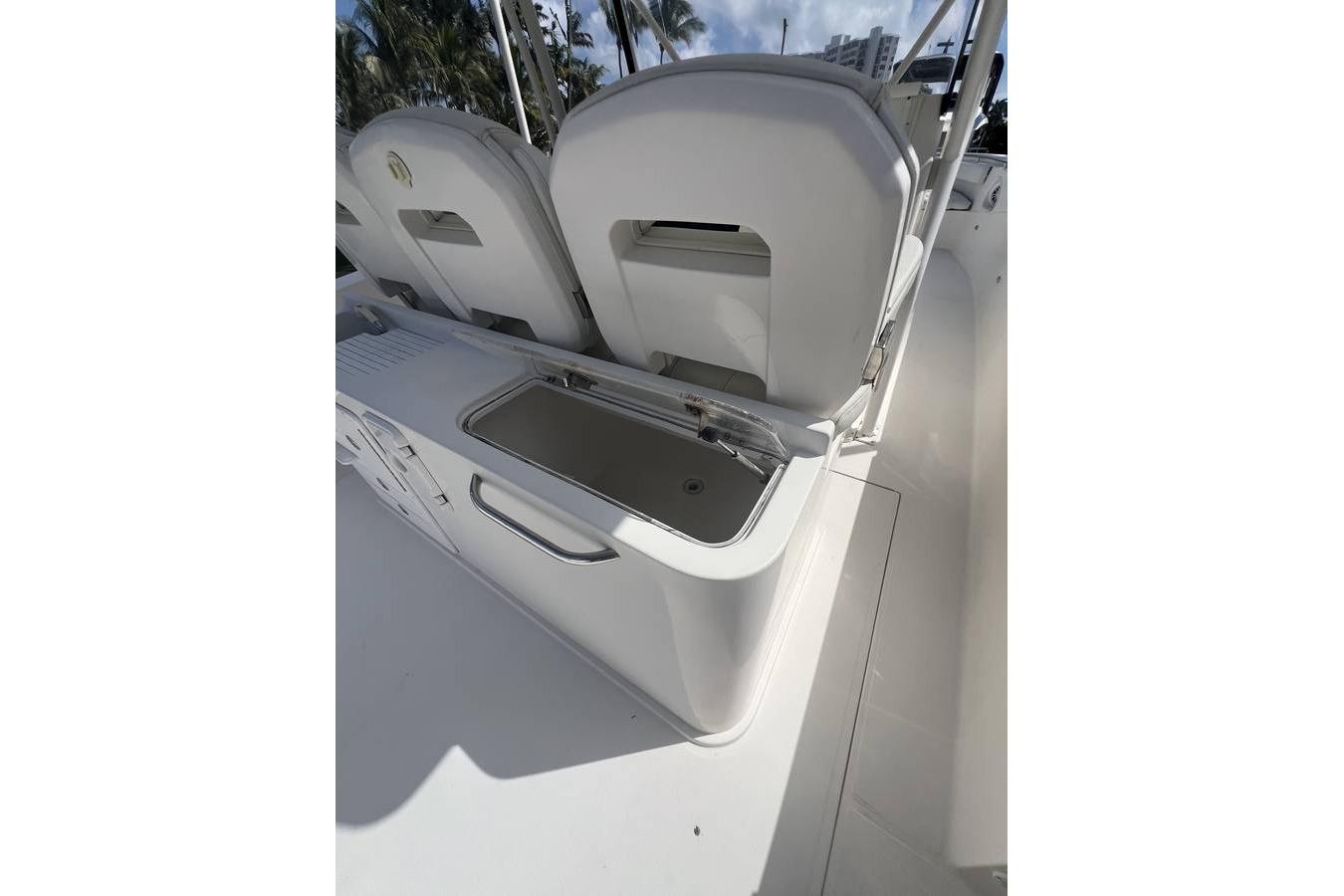 2014 Stamas 390 Tarpon boat interior with seating and storage compartment.