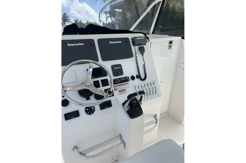  Yacht Photos Pics 2014 Stamas 390 Tarpon boat dashboard with Raymarine electronics and steering wheel.