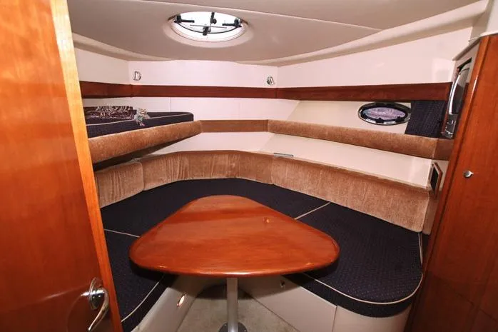 Alta Levica Yacht Photos Pics 2006 Meridian 368 Motoryacht interior with cozy seating and wooden table.