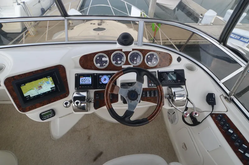 Alta Levica Yacht Photos Pics 2006 Meridian 368 Motoryacht helm with navigation instruments and steering wheel.