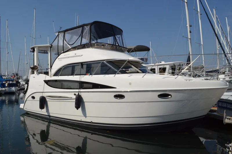 Alta Levica Yacht Photos Pics 2006 Meridian 368 Motoryacht docked in a marina, surrounded by sailboats.