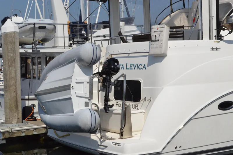 Alta Levica Yacht Photos Pics 2006 Meridian 368 Motoryacht with dinghy and outboard motor at marina.