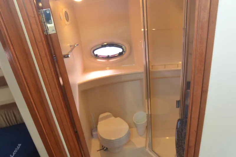 Alta Levica Yacht Photos Pics Bathroom interior of 2006 Meridian 368 Motoryacht with shower and porthole window.