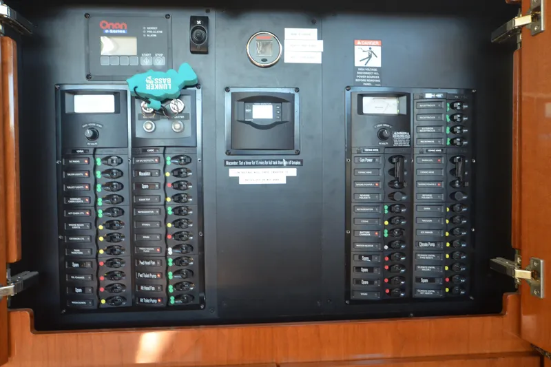 Alta Levica Yacht Photos Pics Electrical control panel of 2006 Meridian 368 Motoryacht with labeled switches and gauges.
