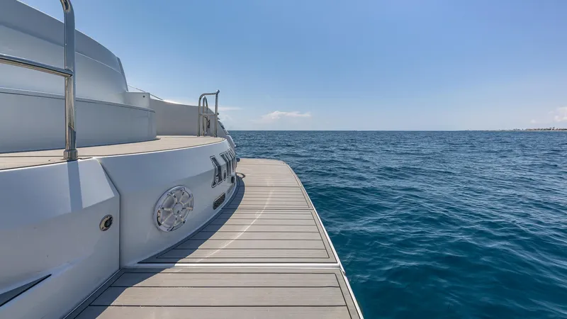  Yacht Photos Pics Custom 650 Catamaran 2010 on open sea, sunny day, wooden deck view.