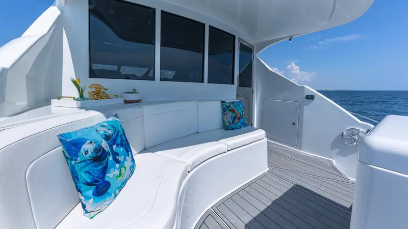  Yacht Photos Pics Luxurious 2010 Custom 650 Catamaran with white seating and ocean-themed pillows on deck.