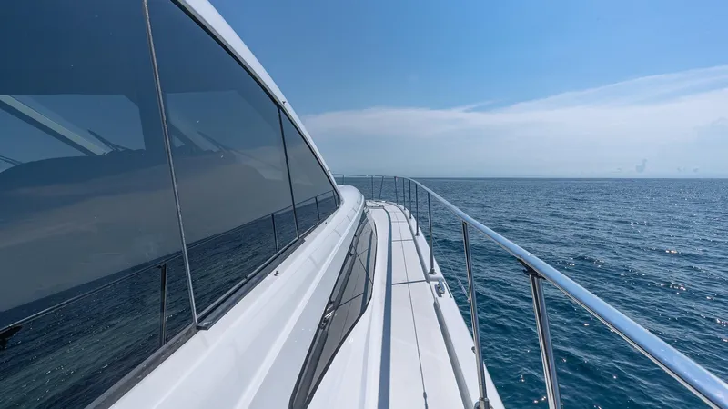  Yacht Photos Pics Custom 650 Catamaran 2010 cruising on open sea under clear blue sky.