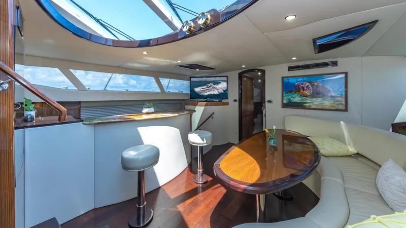  Yacht Photos Pics Luxurious interior of 2010 Custom 650 Catamaran with modern seating and skylight.