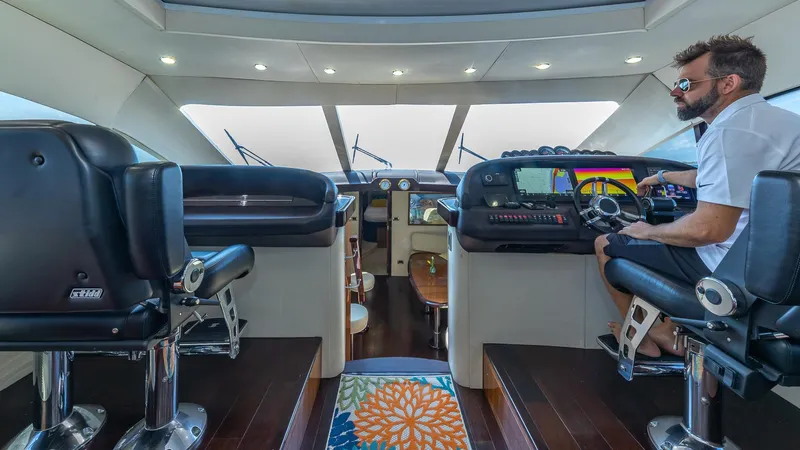  Yacht Photos Pics Interior of 2010 Custom 650 Catamaran with modern helm and seating.