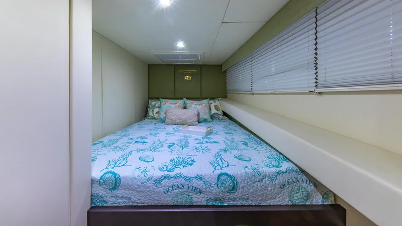  Yacht Photos Pics Luxurious bedroom interior on 2010 Custom 650 Catamaran with ocean-themed bedding.