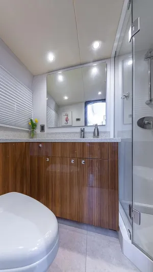  Yacht Photos Pics Luxurious bathroom in 2010 Custom 650 Catamaran with modern fixtures and wood cabinetry.