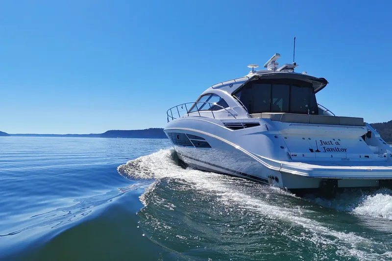  Yacht Photos Pics 2016 Sea Ray Sundancer 510 yacht cruising on a clear blue sea.