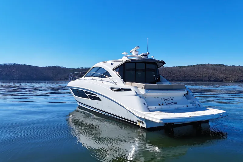  Yacht Photos Pics 2016 Sea Ray Sundancer 510 yacht on calm water under clear blue sky.