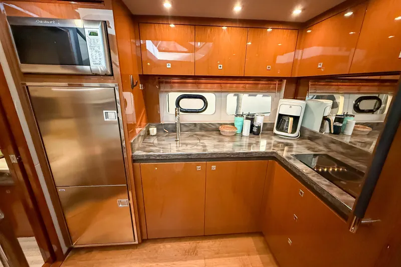  Yacht Photos Pics Luxurious kitchen interior of 2016 Sea Ray Sundancer 510 yacht with modern appliances.