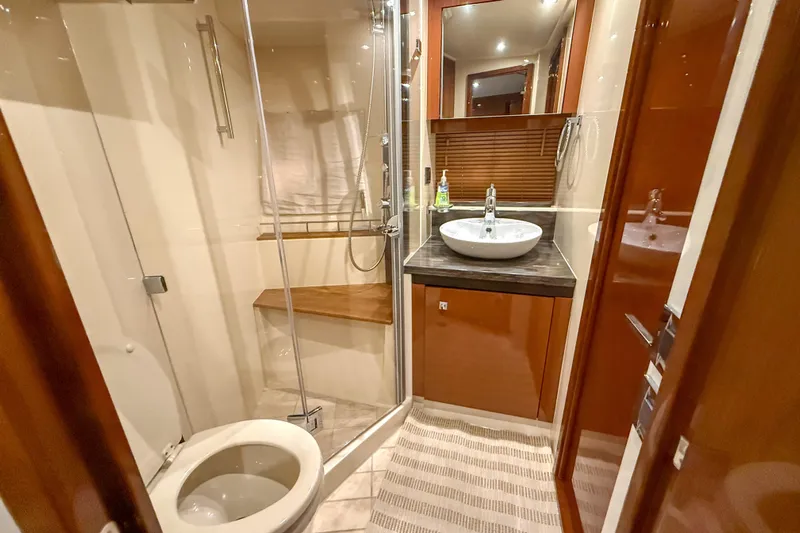  Yacht Photos Pics Luxurious bathroom in 2016 Sea Ray Sundancer 510 yacht with modern fixtures and shower.