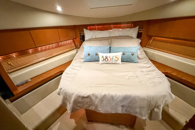  Yacht Photos Pics Luxurious 2016 Sea Ray Sundancer 510 yacht bedroom with cozy bedding and elegant wood accents.
