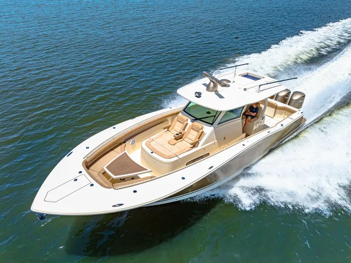  Yacht Photos Pics 2018 Scout 380 LXF boat cruising on open water.