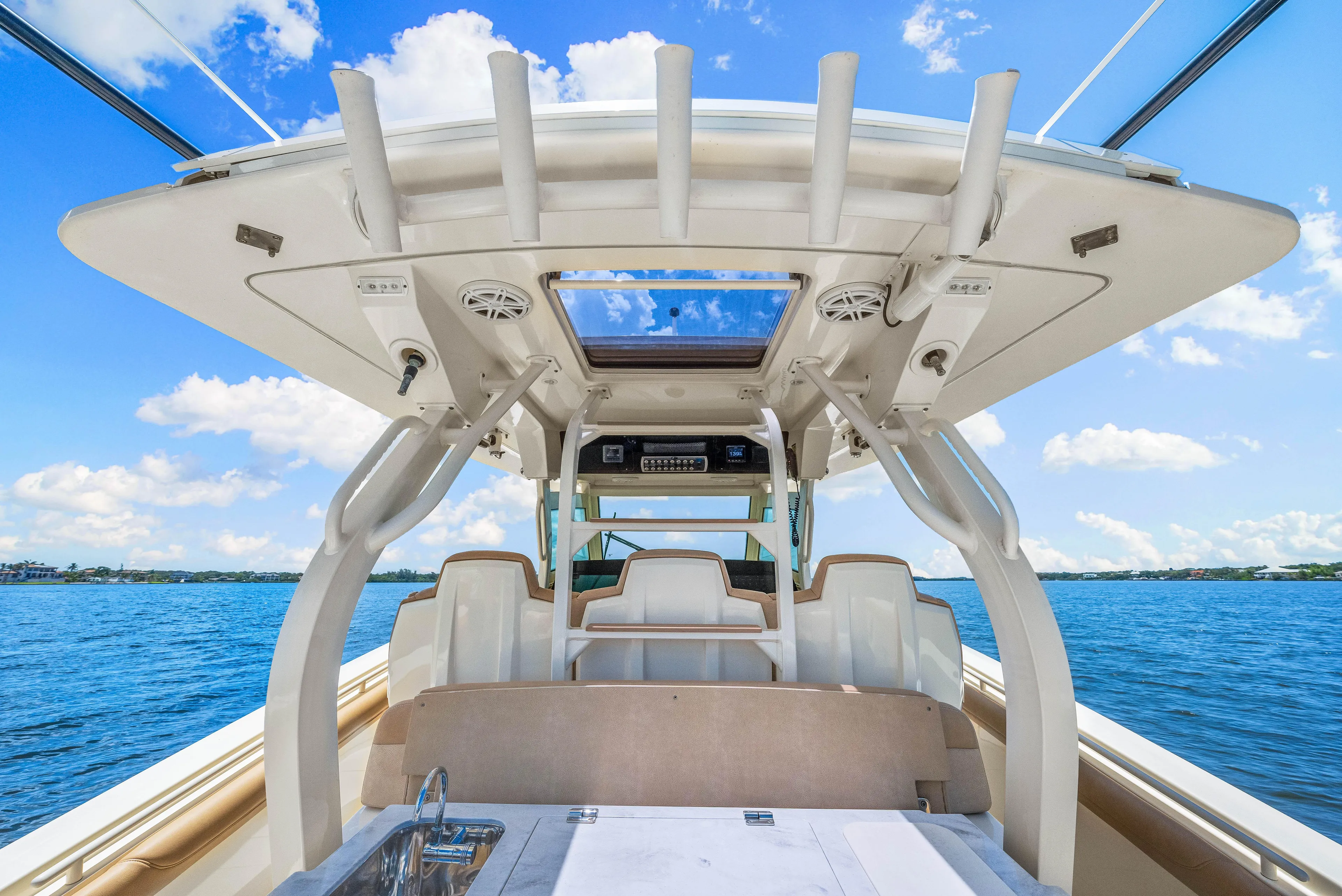  Yacht Photos Pics 2018 Scout 380 LXF boat interior with ocean view and blue sky.