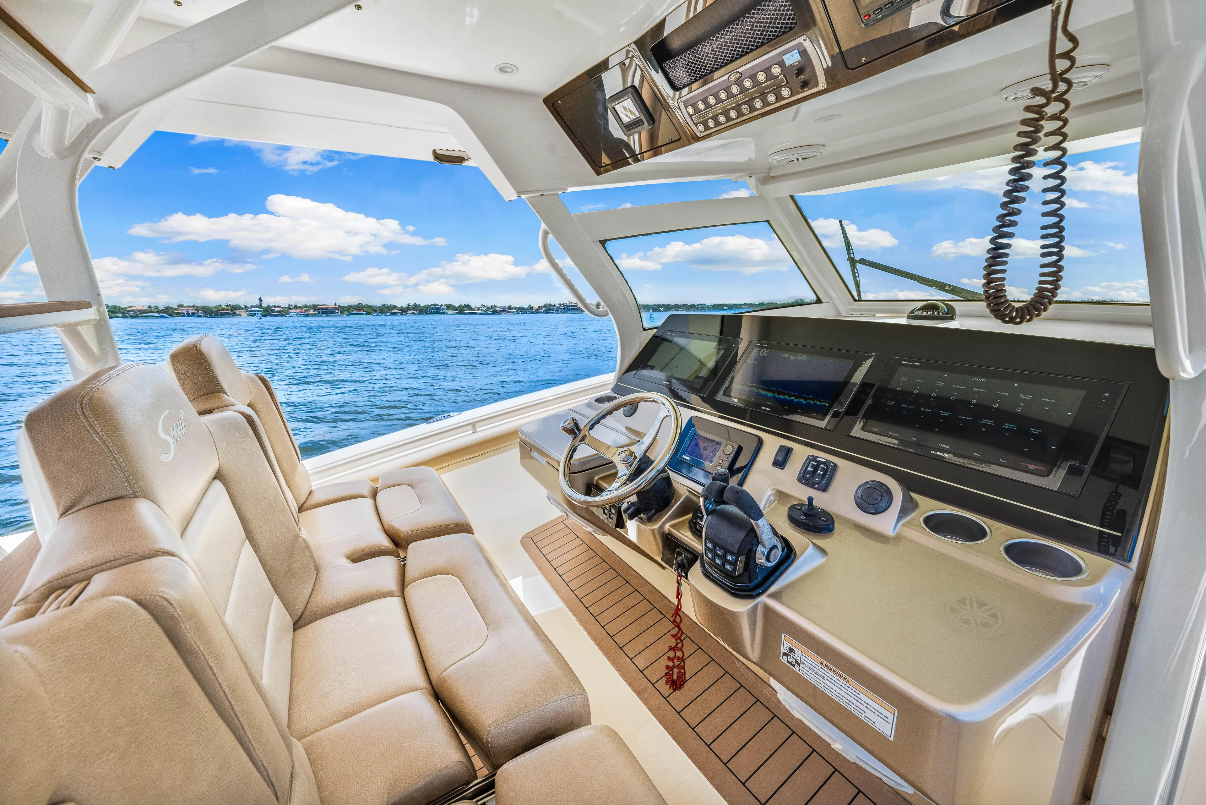  Yacht Photos Pics Interior cockpit of 2018 Scout 380 LXF boat with luxurious seating and advanced navigation system.