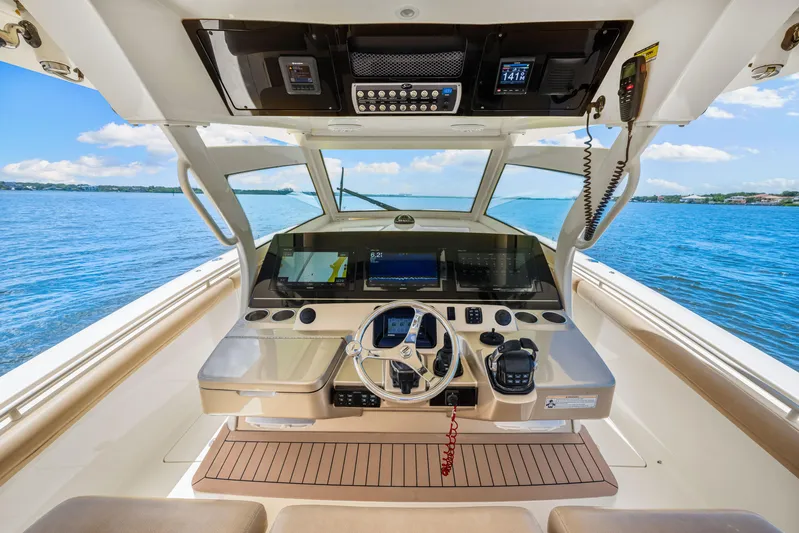  Yacht Photos Pics 2018 Scout 380 LXF boat helm with advanced navigation system and ocean view.
