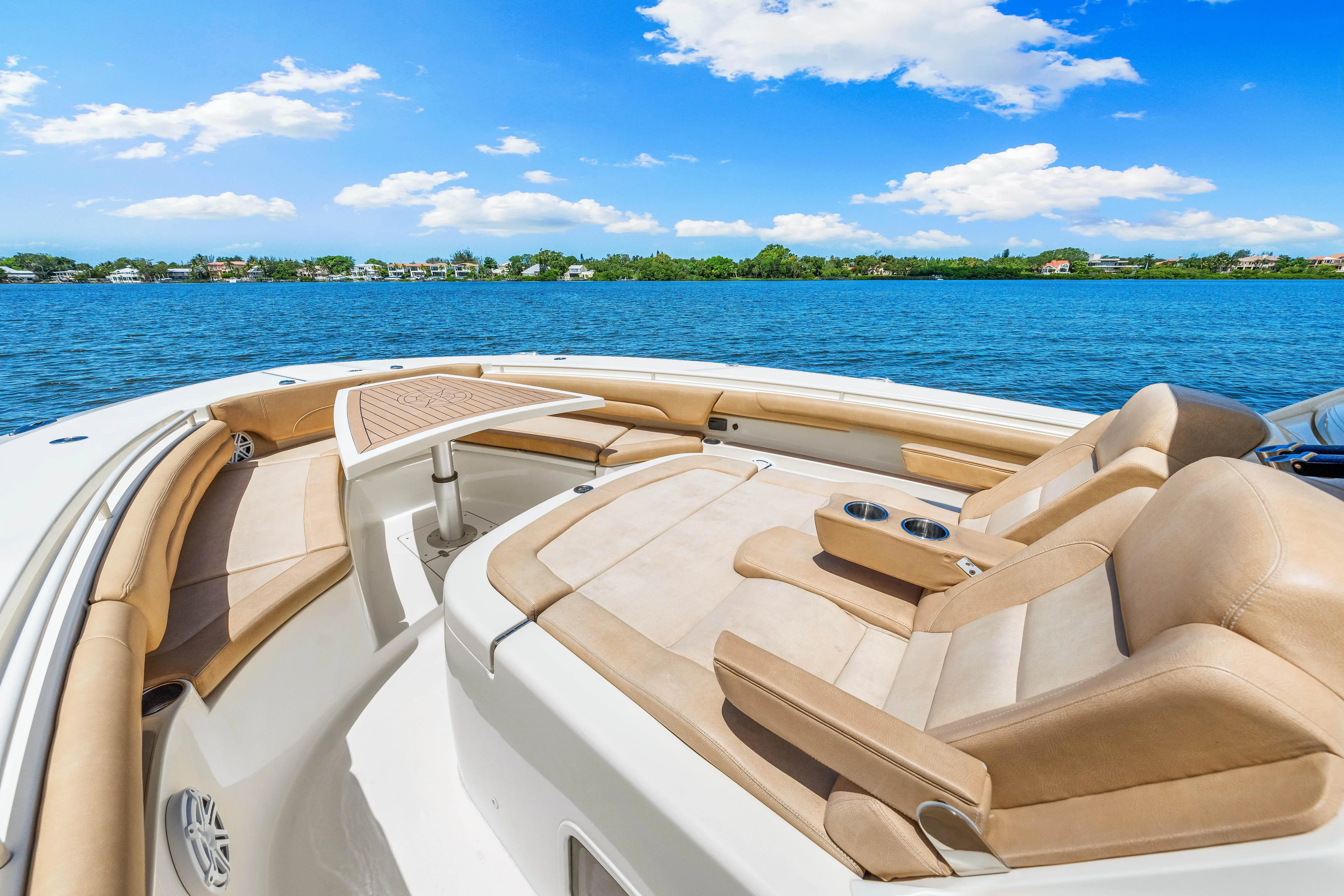  Yacht Photos Pics 2018 Scout 380 LXF boat with luxurious seating on a sunny day.