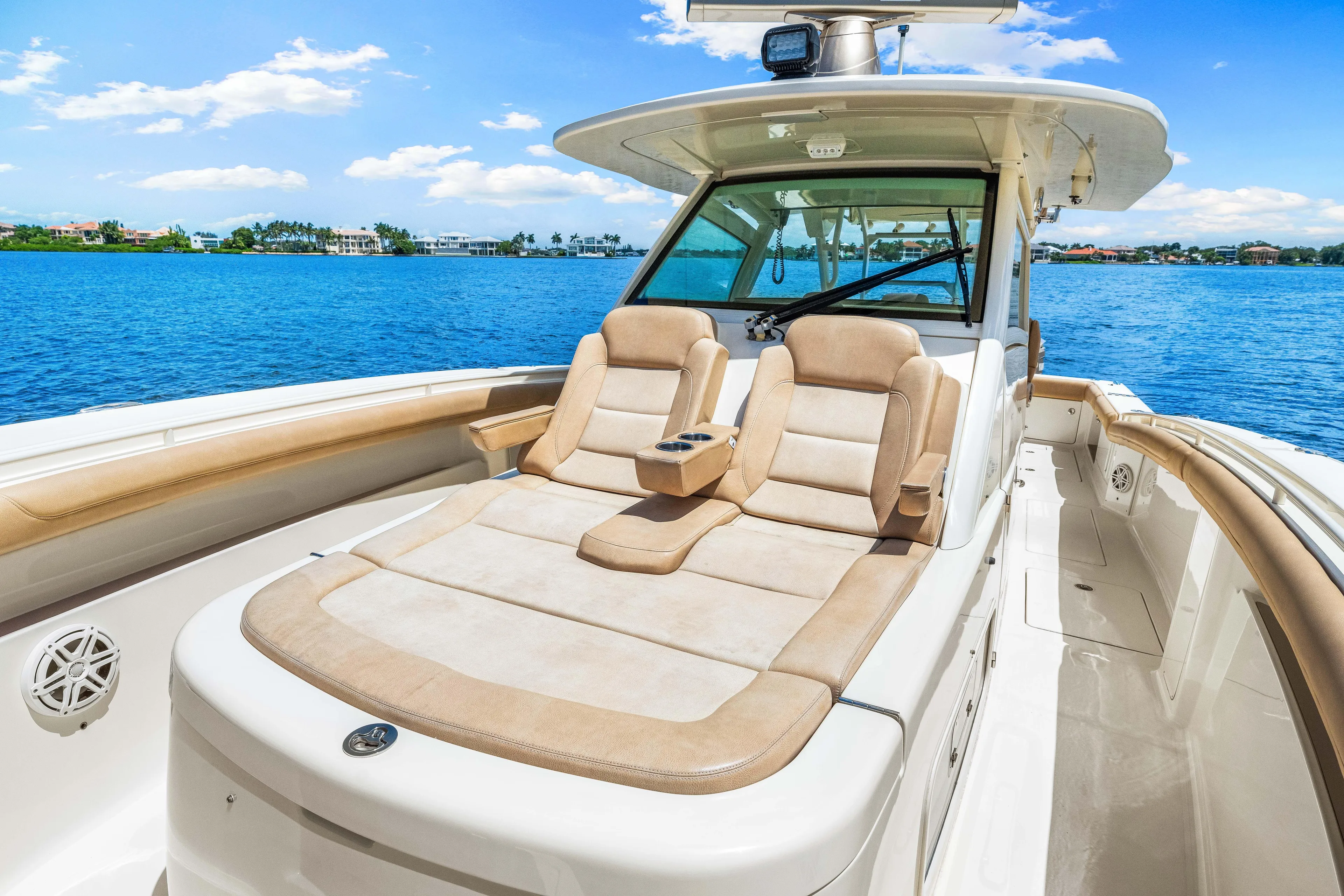  Yacht Photos Pics 2018 Scout 380 LXF boat with luxurious seating on a sunny day.