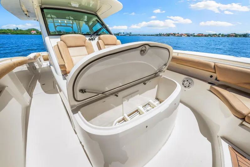  Yacht Photos Pics 2018 Scout 380 LXF boat interior with open storage compartment.