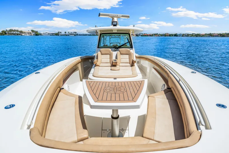  Yacht Photos Pics 2018 Scout 380 LXF luxury boat with spacious seating on a sunny day.