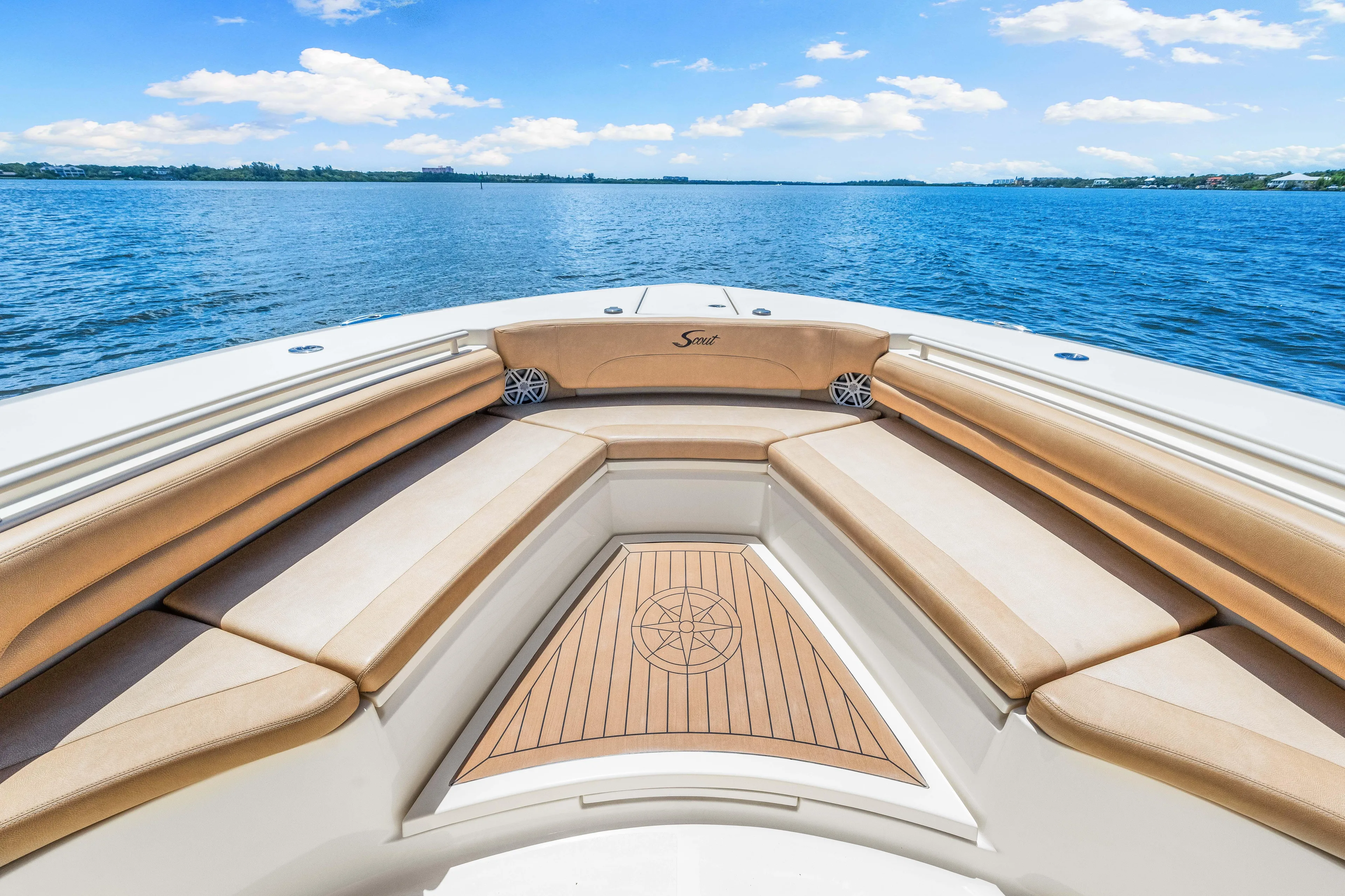  Yacht Photos Pics 2018 Scout 380 LXF boat with tan seating and wooden deck on open water.