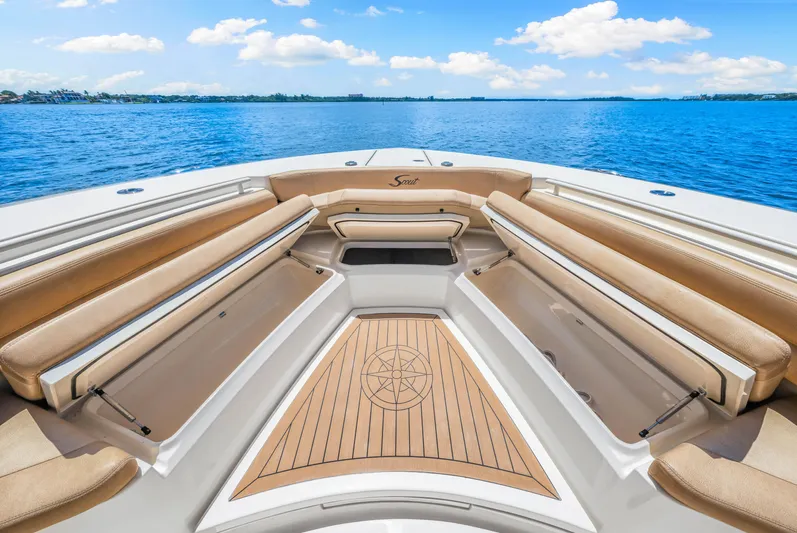  Yacht Photos Pics 2018 Scout 380 LXF boat interior with tan seating and wooden deck.