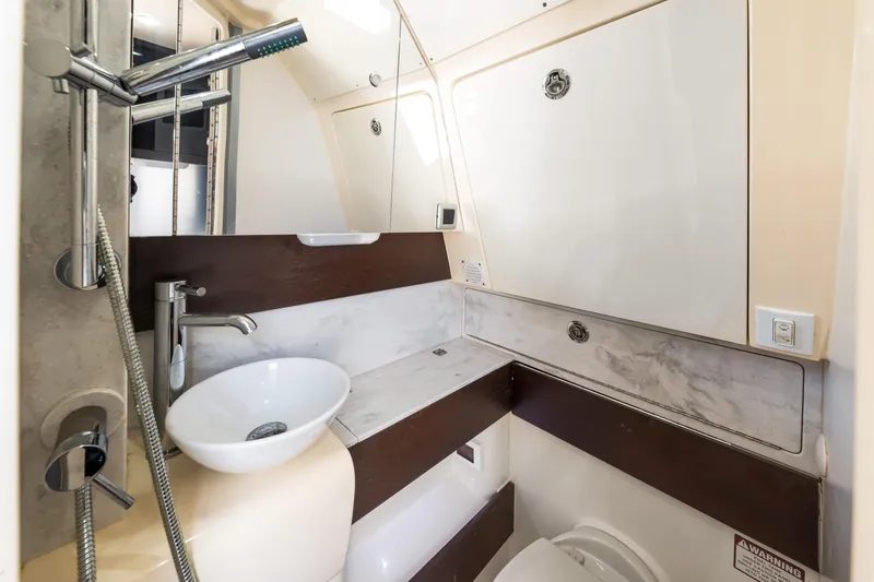  Yacht Photos Pics 2018 Scout 380 LXF boat bathroom with modern fixtures and sleek design.