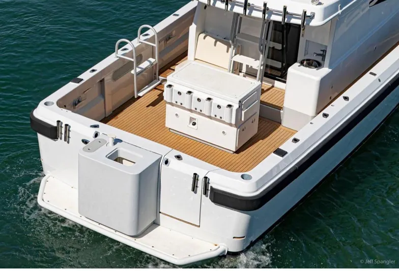  Yacht Photos Pics Custom 2011 Imax Fishing Boat with spacious deck and modern amenities on water.