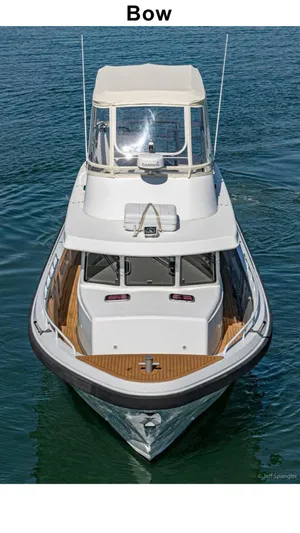  Yacht Photos Pics Custom 2011 Imax Fishing Boat, bow view, on calm water.