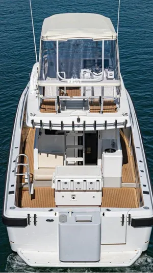  Yacht Photos Pics Custom 2011 Imax Fishing Boat with spacious deck and canopy on calm water.