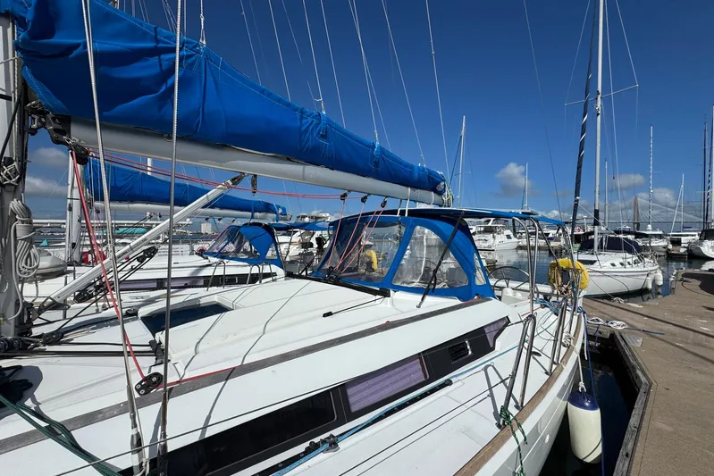 Sea Ranch II Yacht Photos Pics 2018 Jeanneau Sun Odyssey 389 sailboat docked in a marina under clear blue skies.