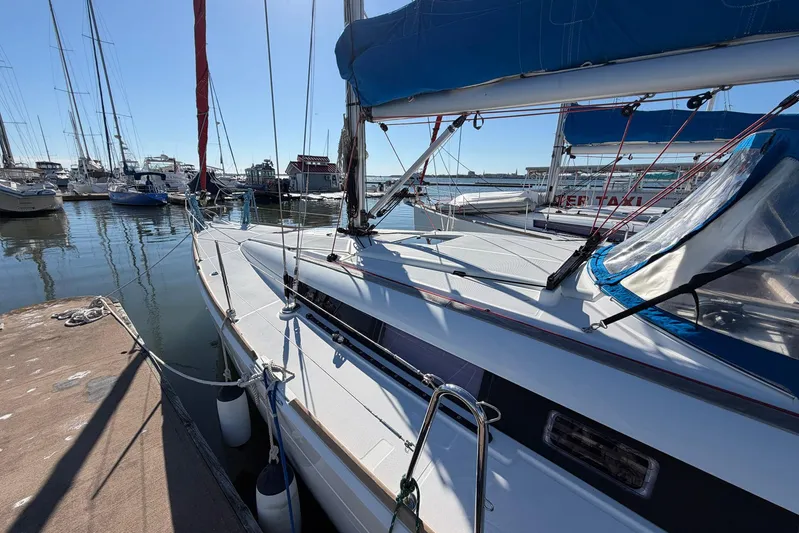 Sea Ranch II Yacht Photos Pics 2018 Jeanneau Sun Odyssey 389 sailboat docked in a marina, surrounded by other boats.