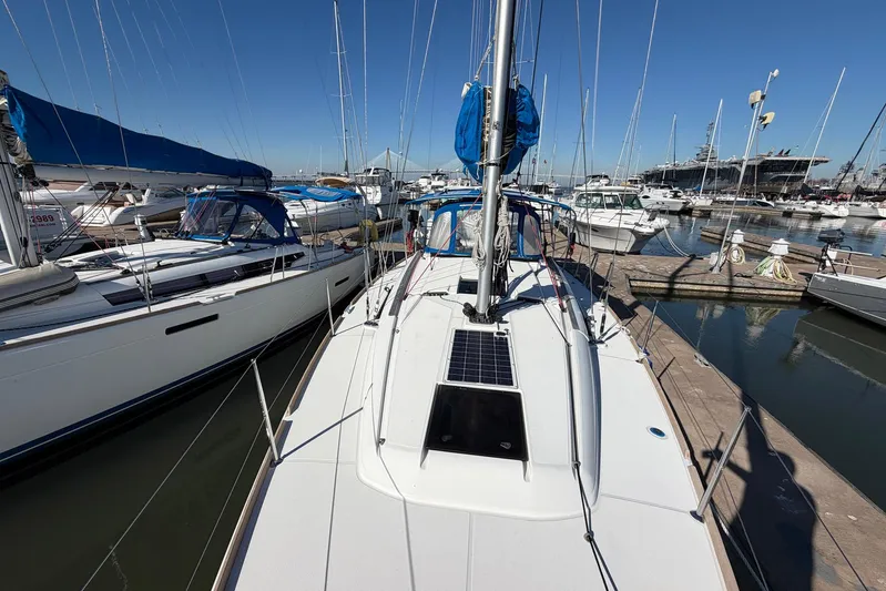 Sea Ranch II Yacht Photos Pics 2018 Jeanneau Sun Odyssey 389 sailboat docked in a marina, surrounded by other boats.