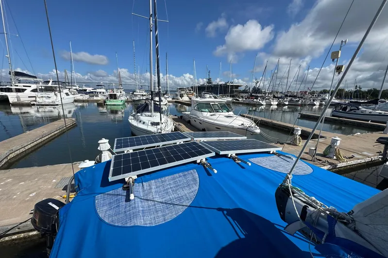 Sea Ranch II Yacht Photos Pics 2018 Jeanneau Sun Odyssey 389 sailboat docked in marina with solar panels on deck.