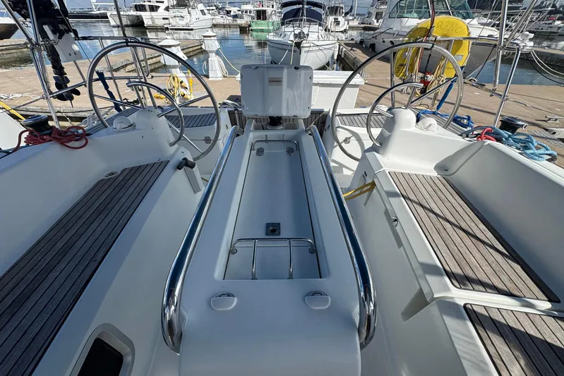 Sea Ranch II Yacht Photos Pics 2018 Jeanneau Sun Odyssey 389 sailboat cockpit with dual steering wheels at marina.