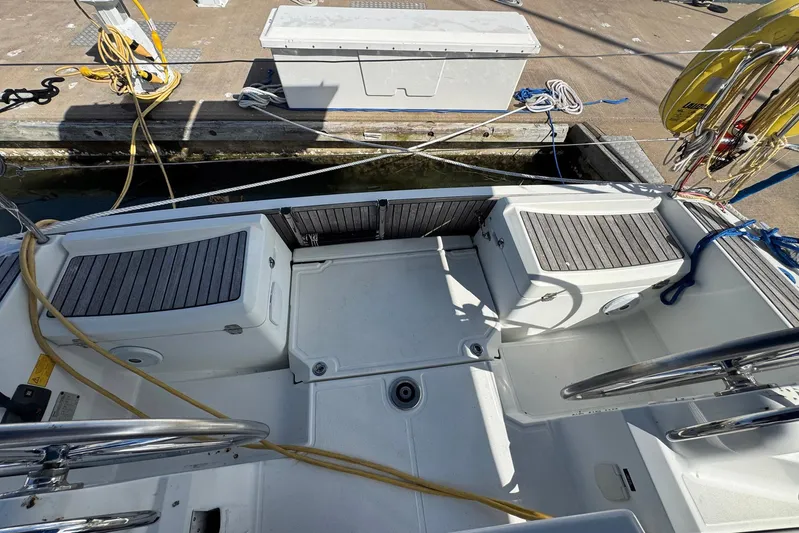 Sea Ranch II Yacht Photos Pics 2018 Jeanneau Sun Odyssey 389 cockpit with seating and dock view.